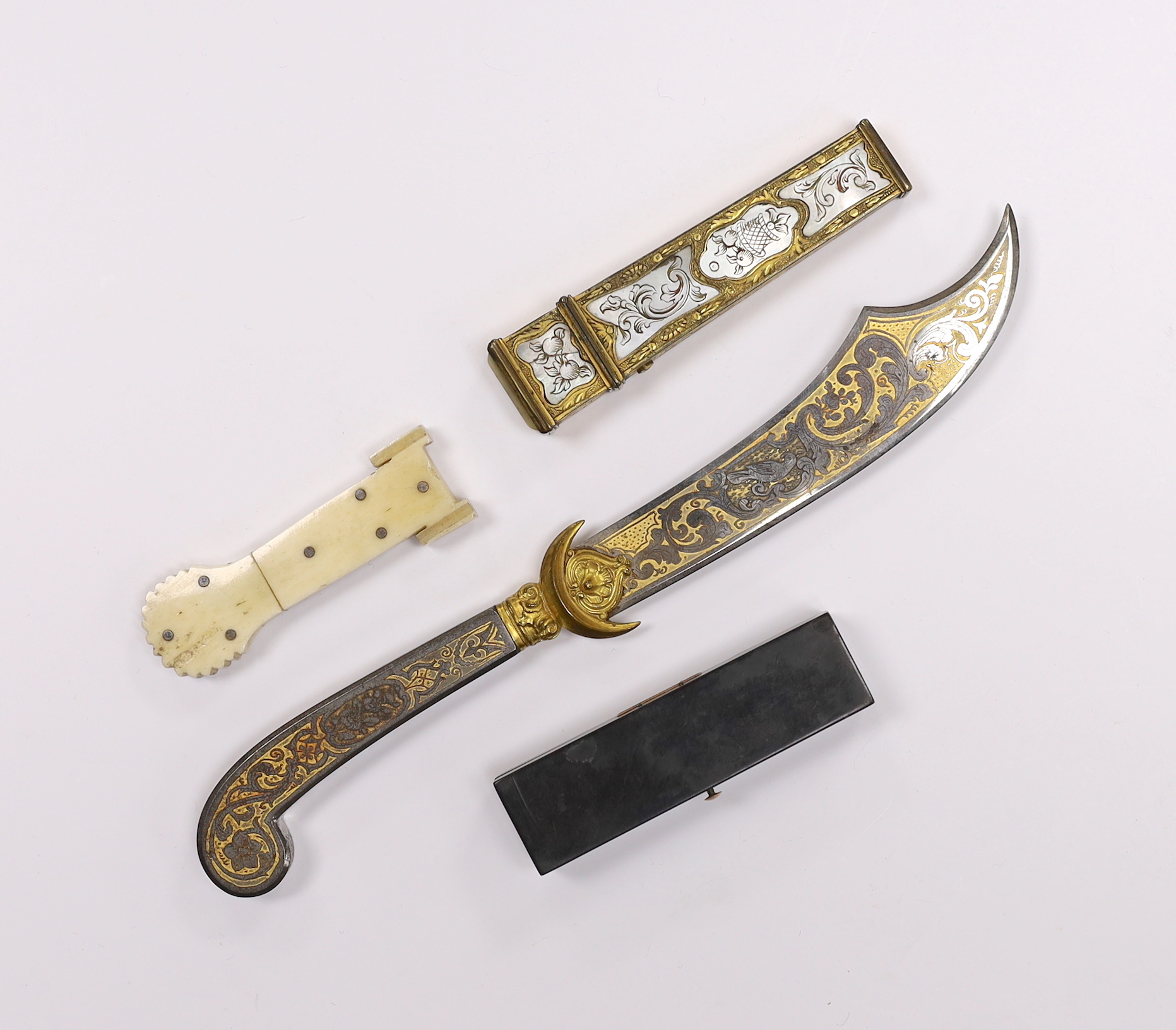 Two 19th century needle cases, one in bone, and one in gilt metal with mother-of-pearl inlay, a tortoiseshell toothpick case and a Toledo paperknife, paper knife 20cm